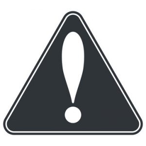 A caution symbol regarding what can you eat with Invisalign